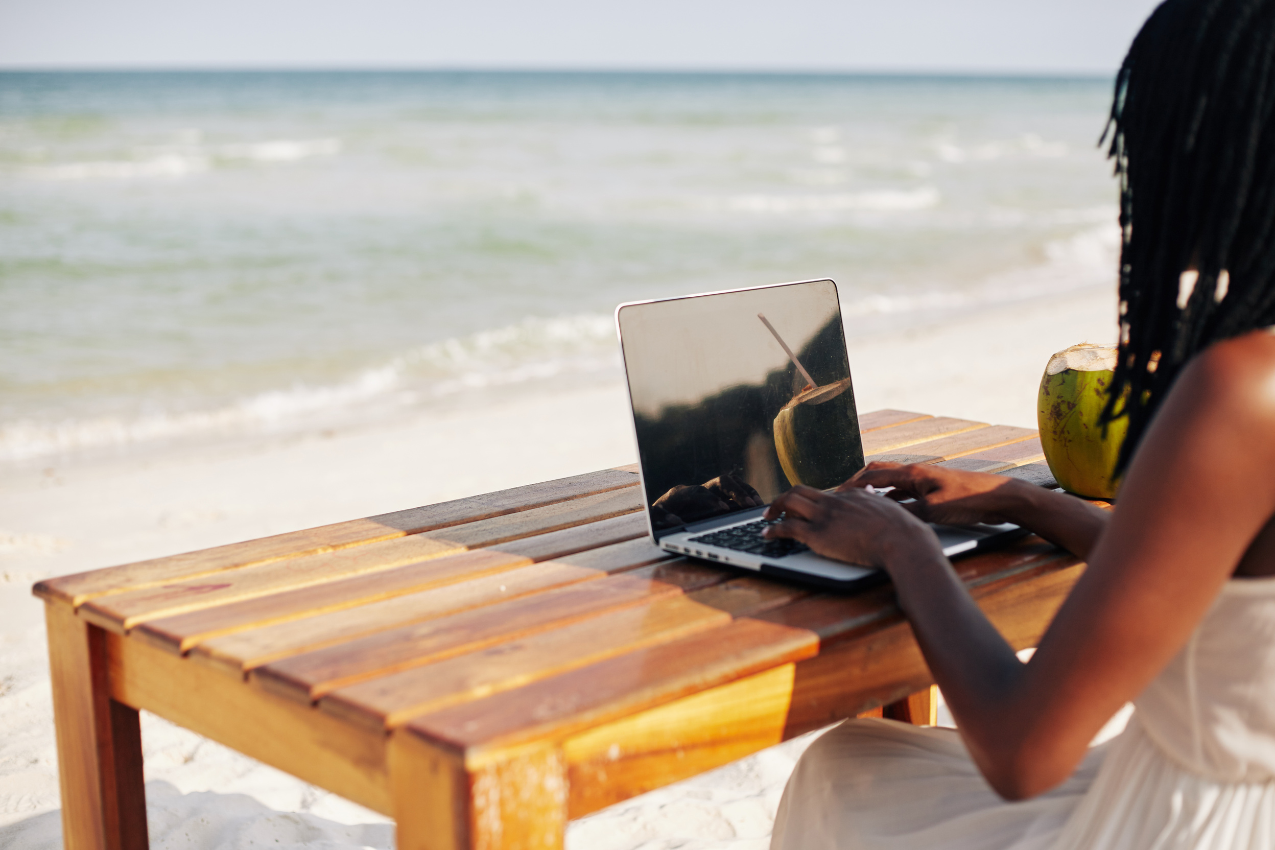 Freelancer Working on Beach